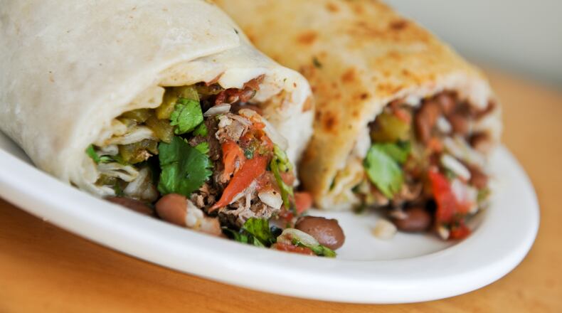 Bell Street Burritos signature dishes Pork and Green Chile BurritoChicken and Tomatillo BurritoBroccoli & Queso BurritoQueso con Chorizo Dip